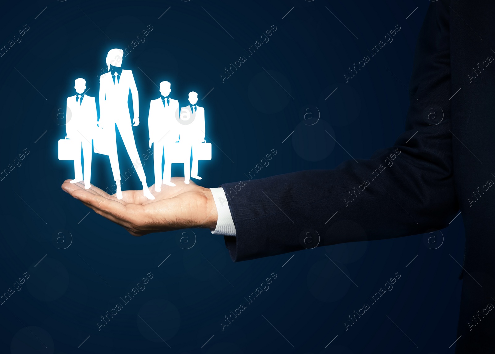 Image of Man presenting virtual icons of businesspeople on dark blue background, closeup. Leadership concept