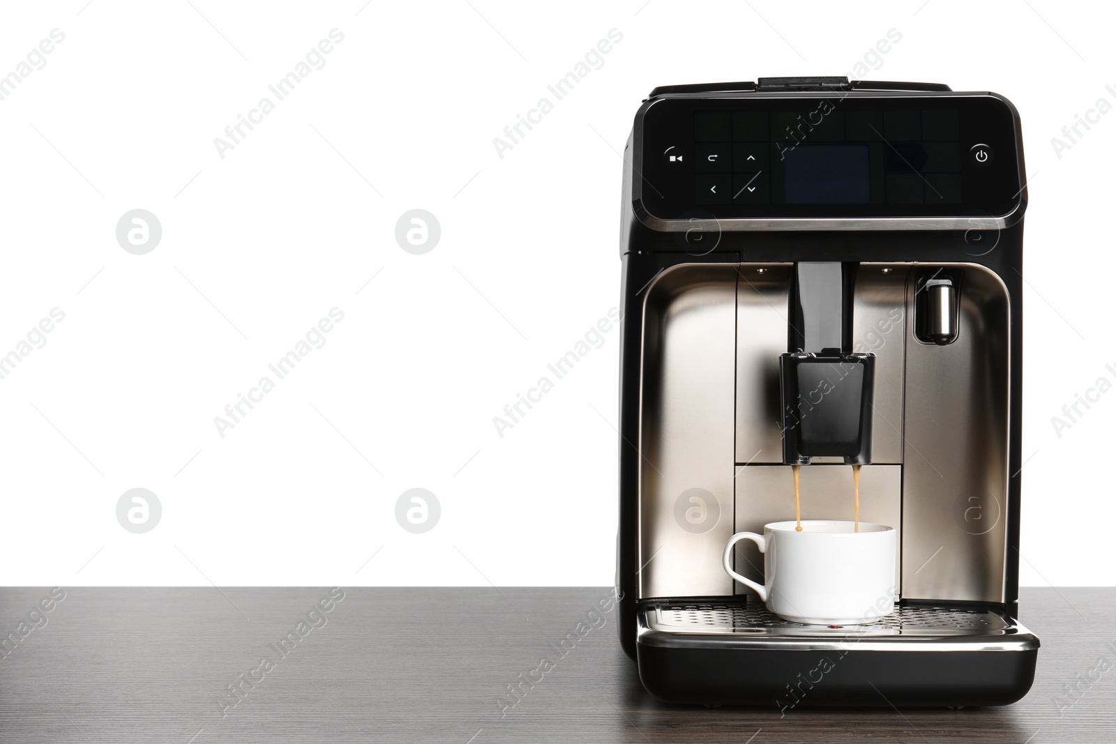 Photo of Modern espresso machine pouring coffee into cup on wooden table against white background. Space for text