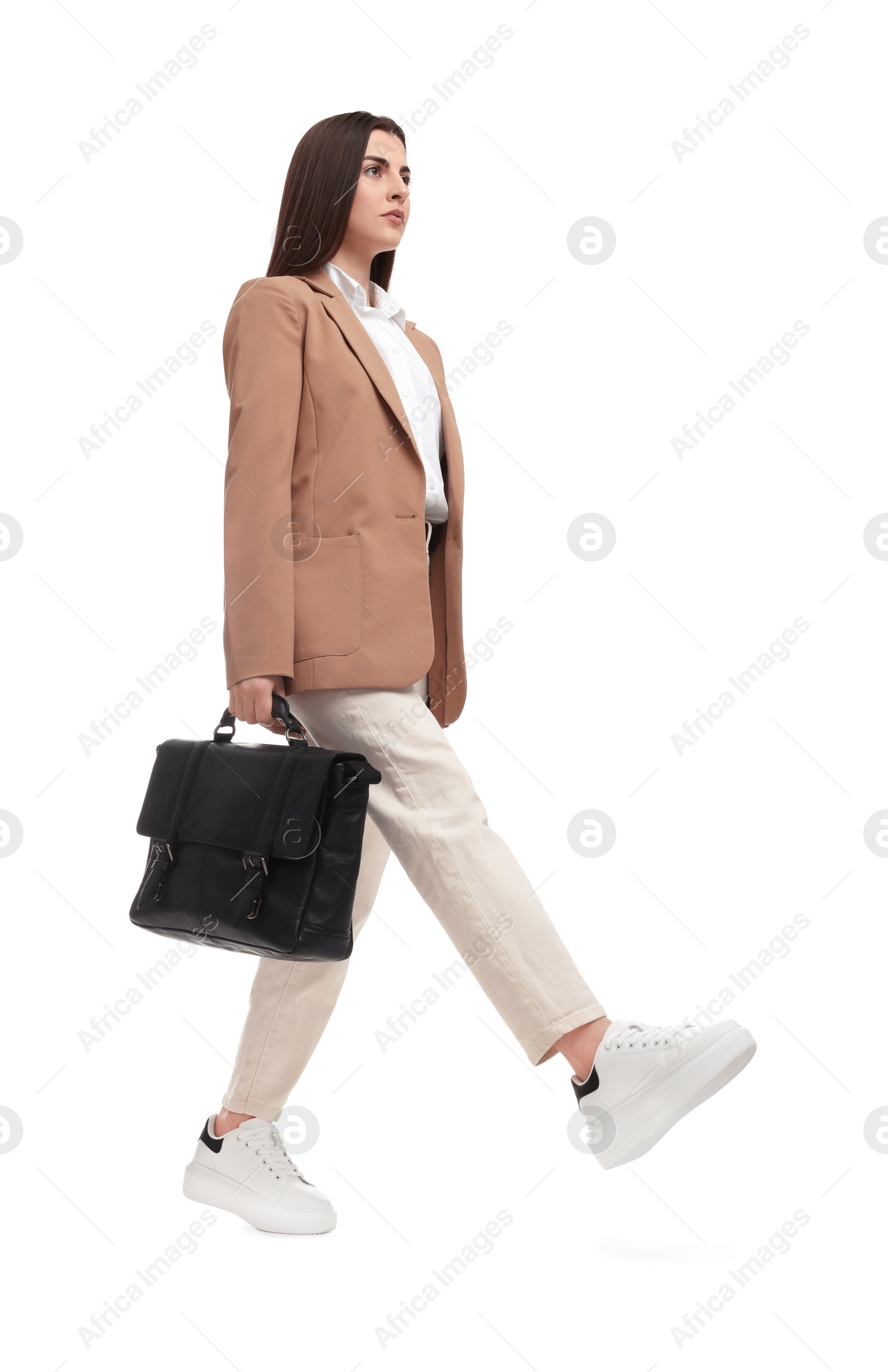 Photo of Beautiful businesswoman with briefcase walking on white background