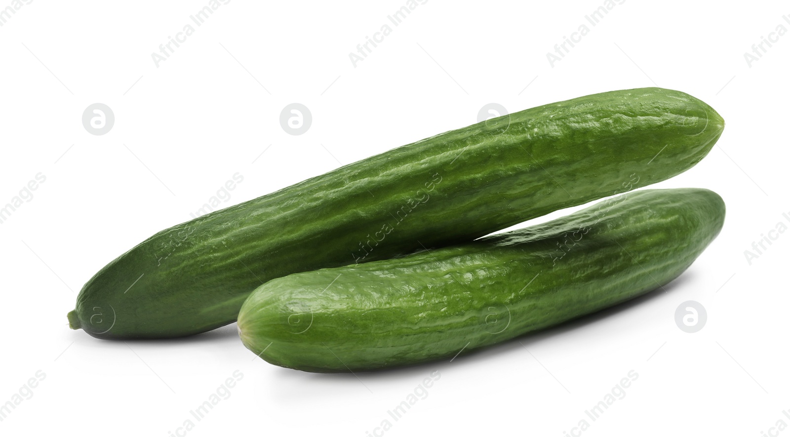 Photo of Two long fresh cucumbers isolated on white