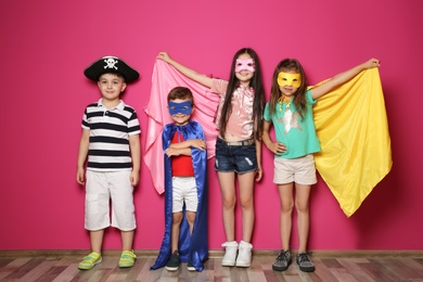 Photo of Playful little children in cute costumes indoors