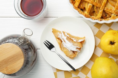 Photo of Piece of tasty homemade quince pie with powdered sugar served on white wooden table, flat lay