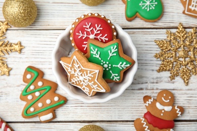 Photo of Bowl with tasty homemade Christmas cookies on table, top view