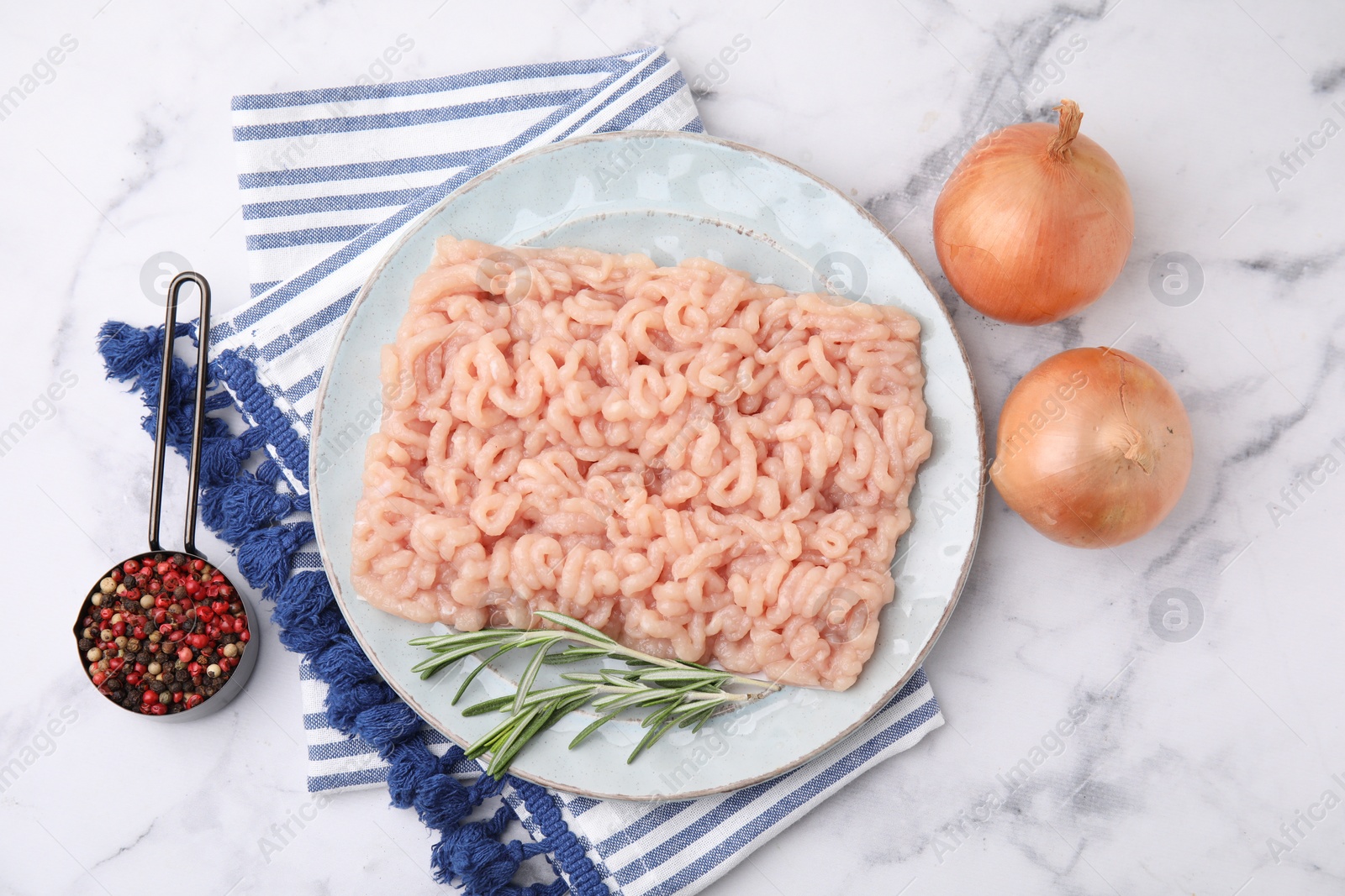 Photo of Flat lay composition with fresh raw minced meat on white marble table