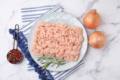 Flat lay composition with fresh raw minced meat on white marble table