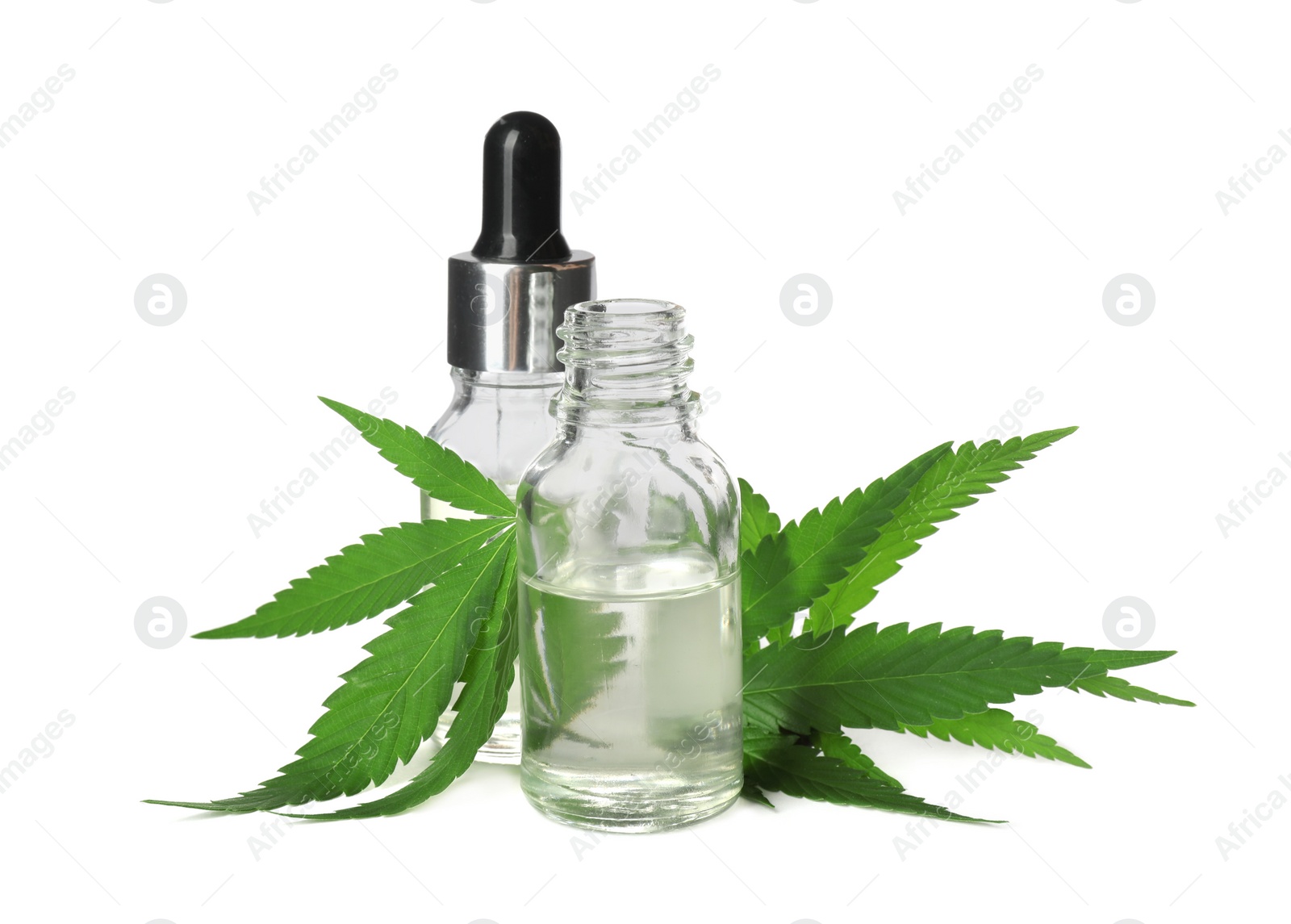 Photo of CBD oil, THC tincture and hemp leaves on white background