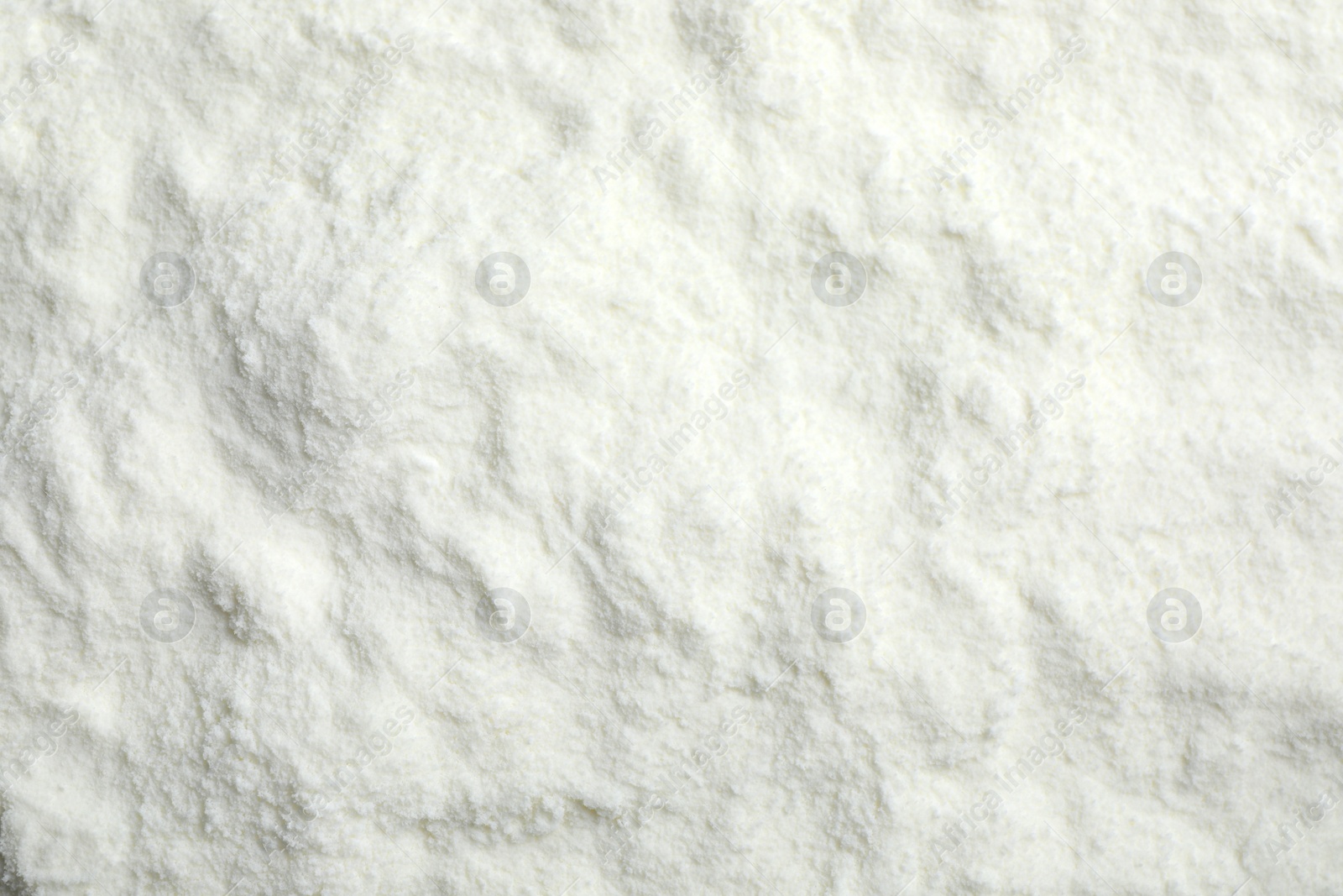 Photo of Top view of powdered infant formula as background. Baby milk