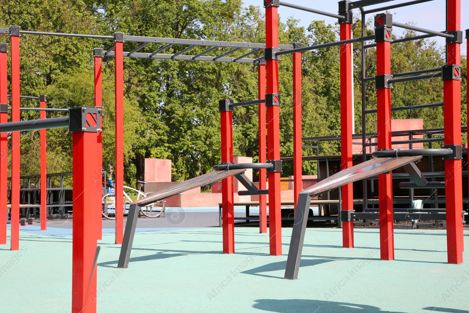 Photo of Empty outdoor gym with exercise equipment in park