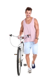 Handsome young hipster man with bicycle on white background