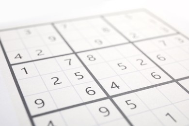 Sudoku puzzle grid as background, closeup view