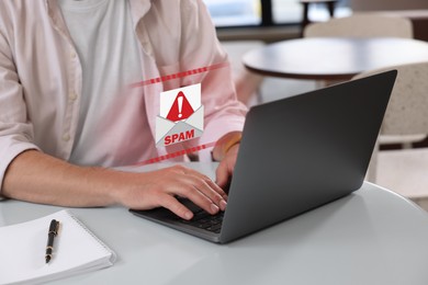 Image of Man using laptop at table, closeup. Spam message notification above device, illustration