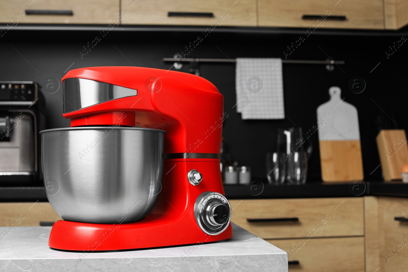 Photo of Modern stand mixer on table in kitchen, space for text. Home appliance