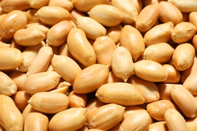 Photo of Fresh peeled peanuts as background, closeup view