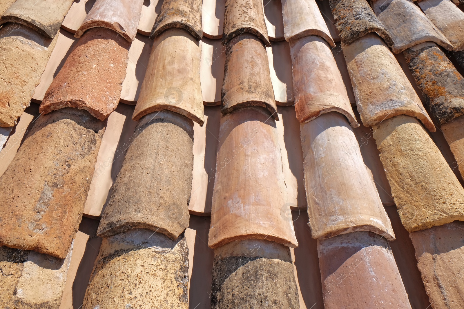 Photo of View of old roof tiles on sunny day as background