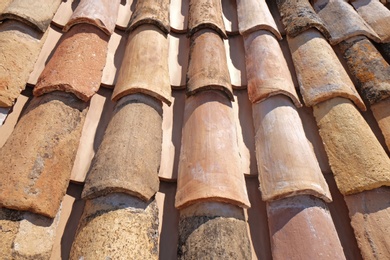 Photo of View of old roof tiles on sunny day as background