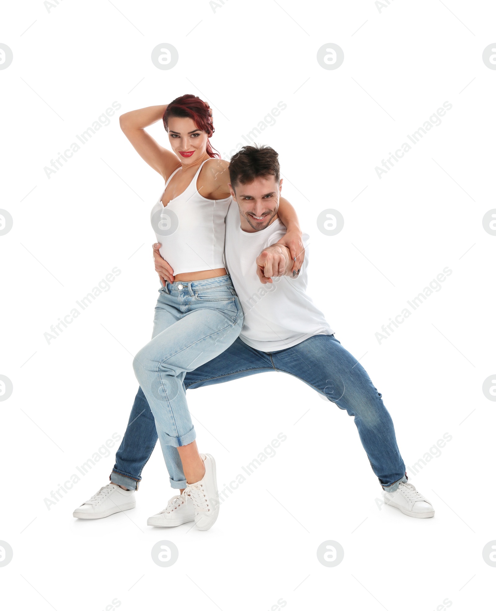 Photo of Beautiful young couple dancing on white background
