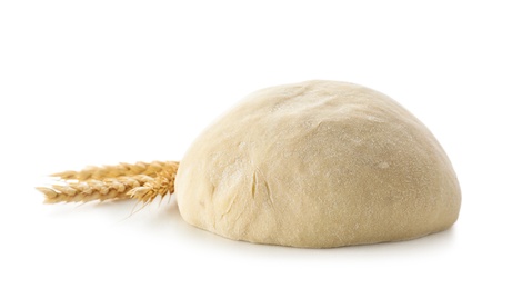 Photo of Raw wheat dough and spikes on white background