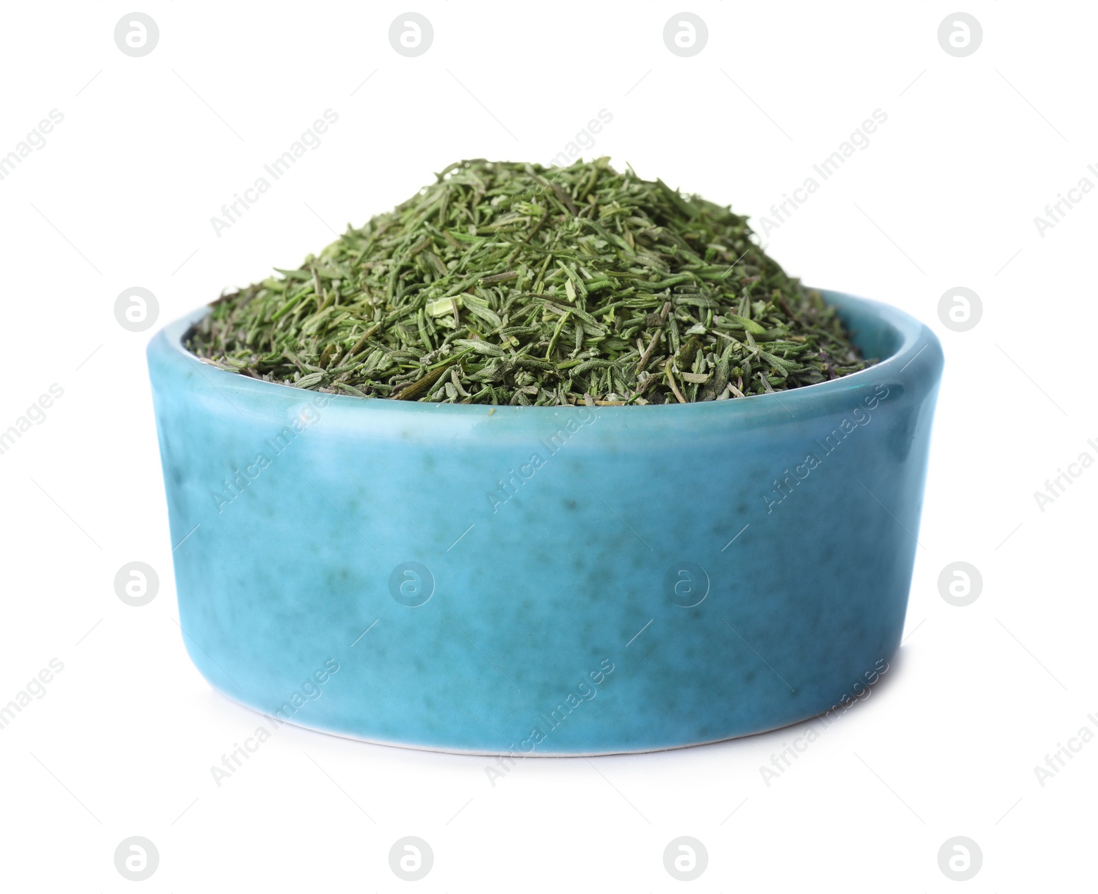 Photo of Bowl of dried thyme isolated on white