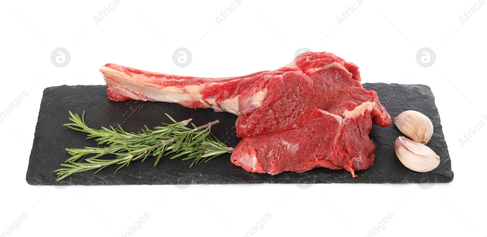 Photo of Raw ribeye steak and spices isolated on white