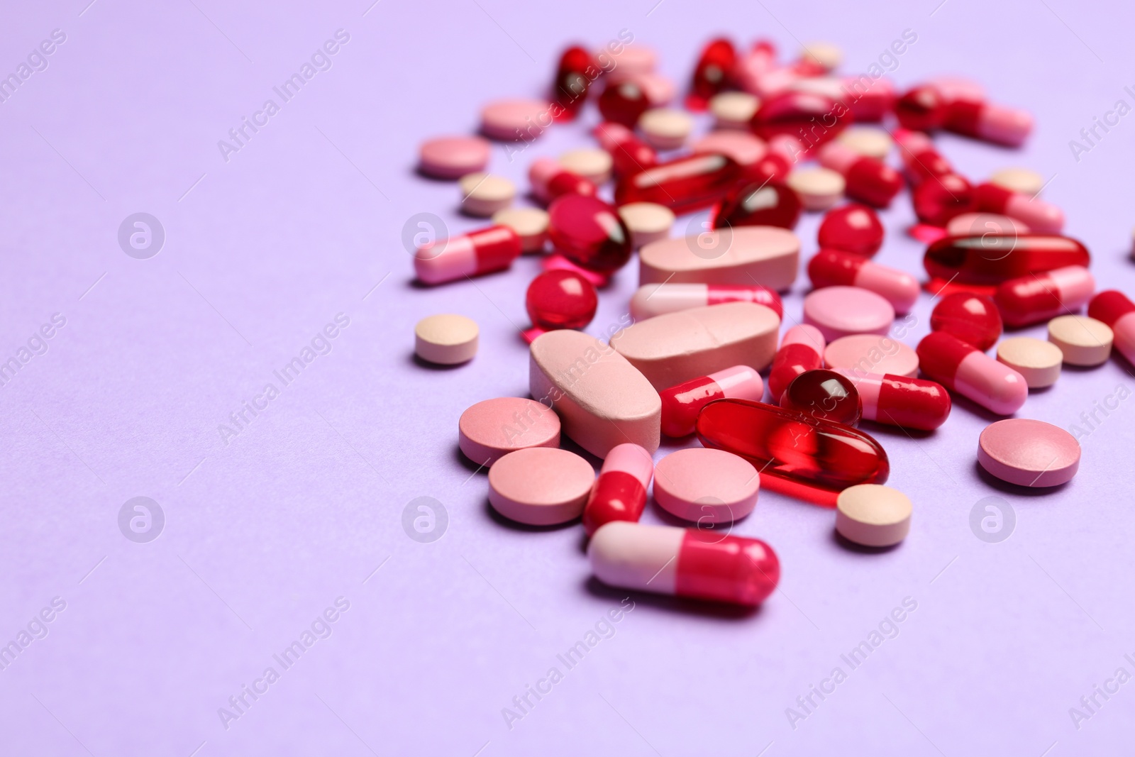 Photo of Different pills and space for text on color background