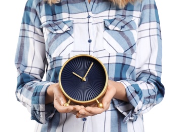 Young woman holding clock on white background. Time management