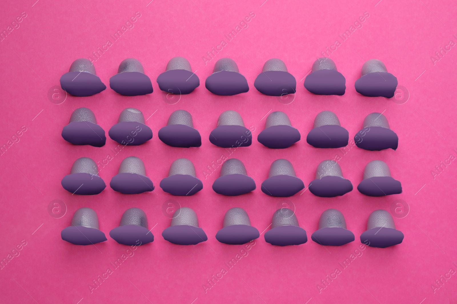 Photo of Tasty bright jelly cups on pink background, flat lay