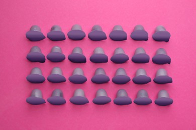 Photo of Tasty bright jelly cups on pink background, flat lay