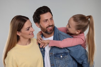 Portrait of happy family on light grey background