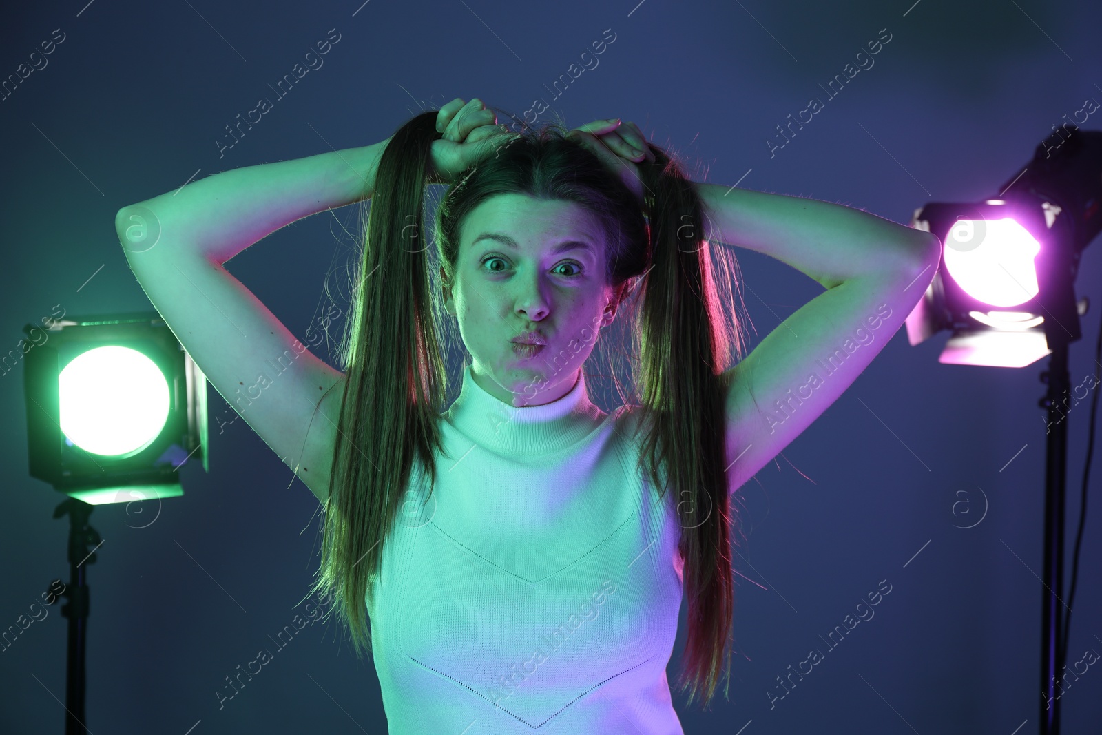 Photo of Portrait of beautiful young woman in photo studio