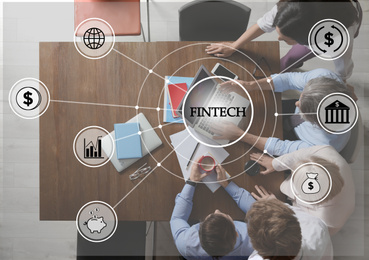 Image of Fintech concept. Business people working at table in office, top view