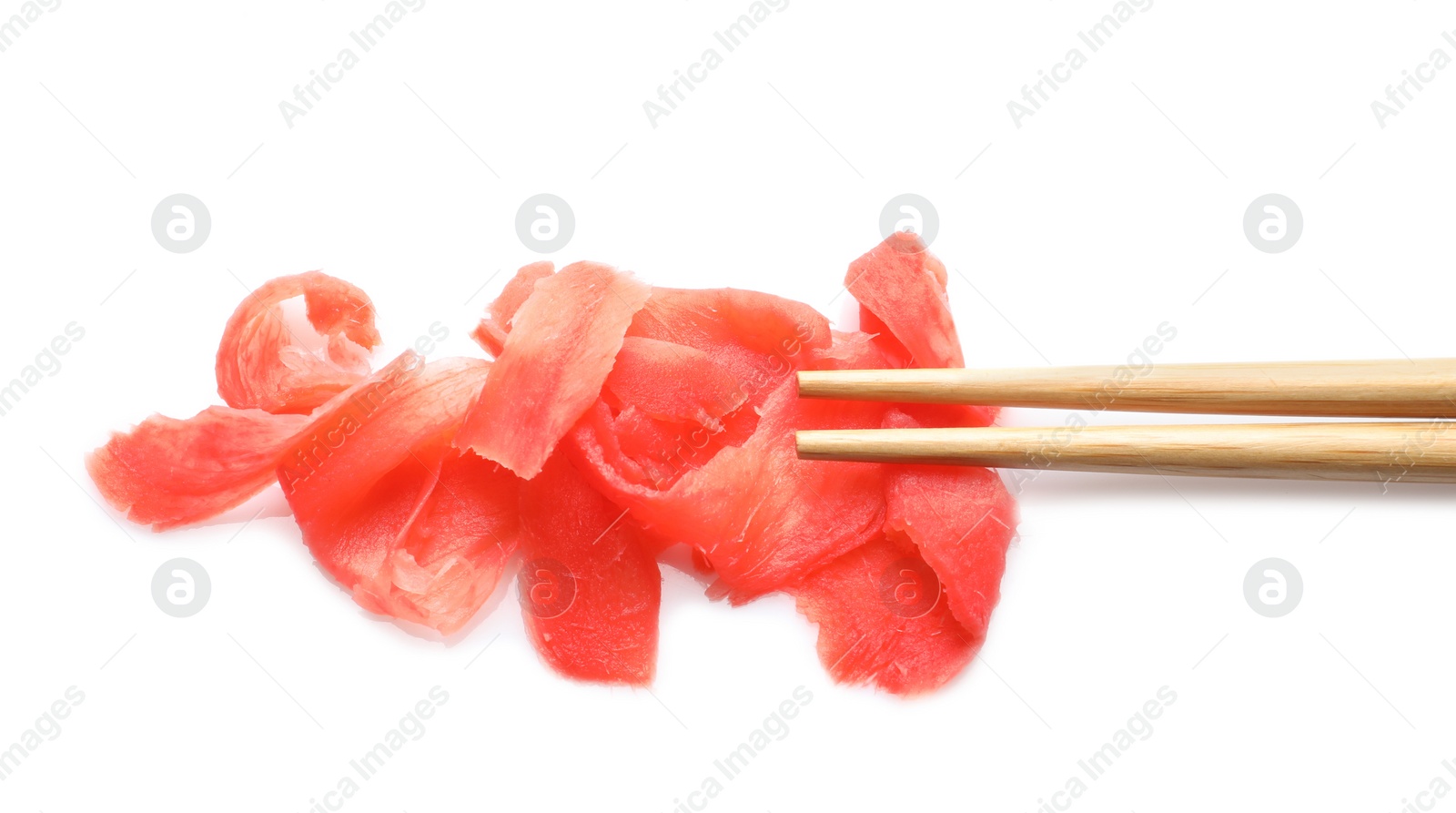 Photo of Piquant pickled ginger and chopsticks on white background, top view. Delicious sauce condiment