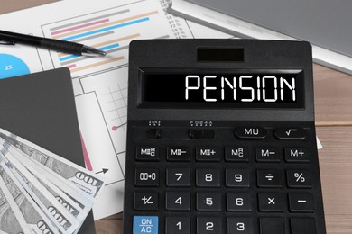 Image of Calculator with word Pension, document, money and stationery on wooden table, closeup