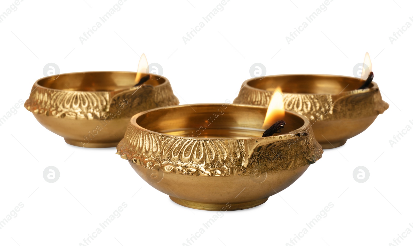 Photo of Lit diya lamps on white background. Diwali celebration