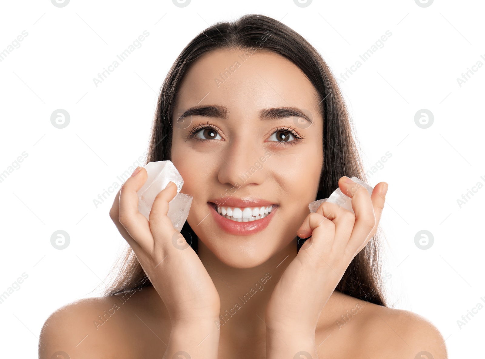 Photo of Young woman with ice cubes on white background. Skin care