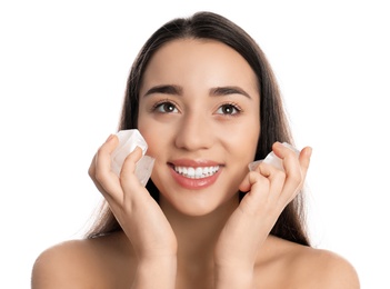 Photo of Young woman with ice cubes on white background. Skin care