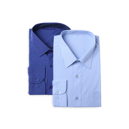 Photo of Stylish shirts isolated on white, top view. Dry-cleaning service