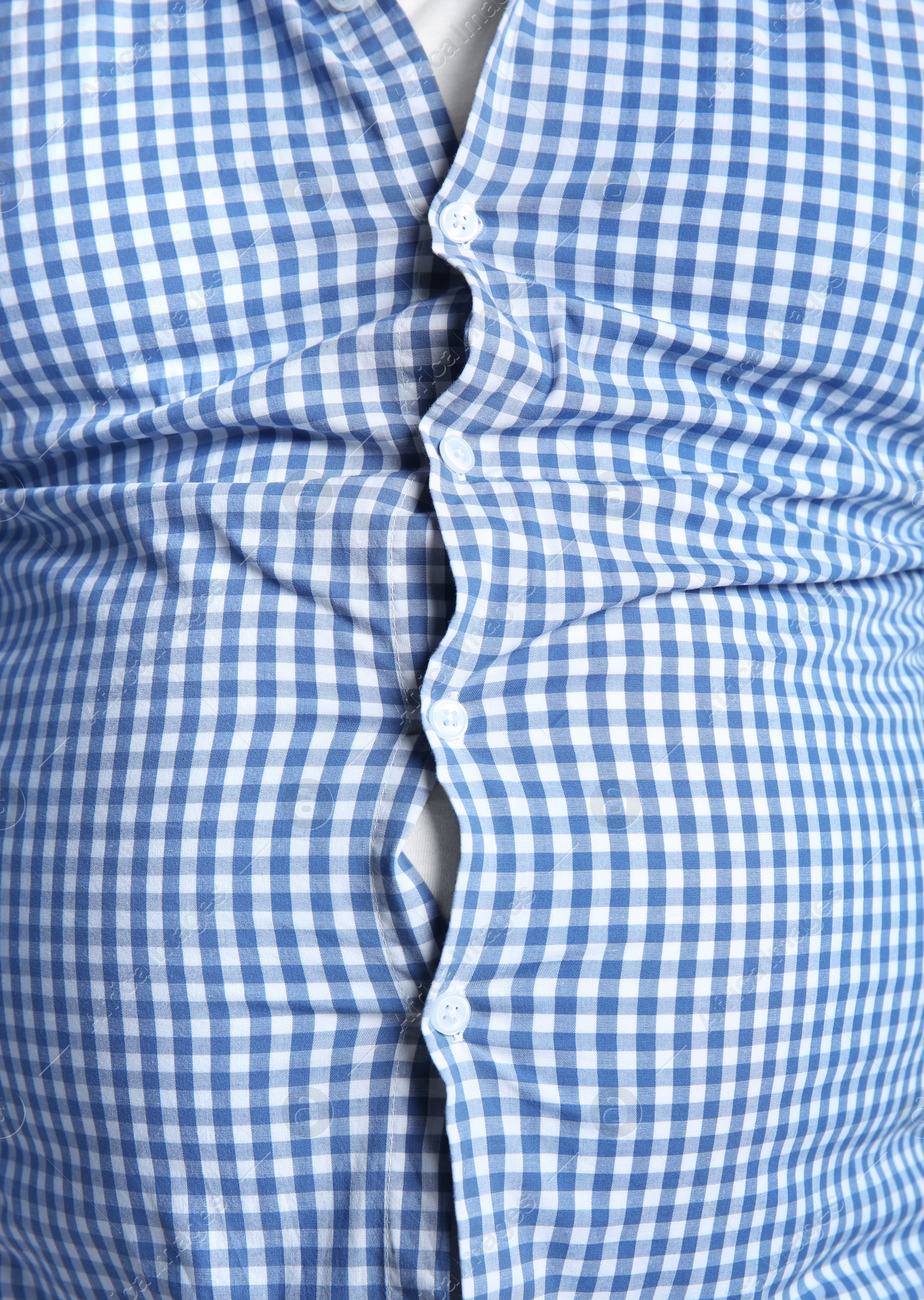 Photo of Overweight person in tight clothes, closeup