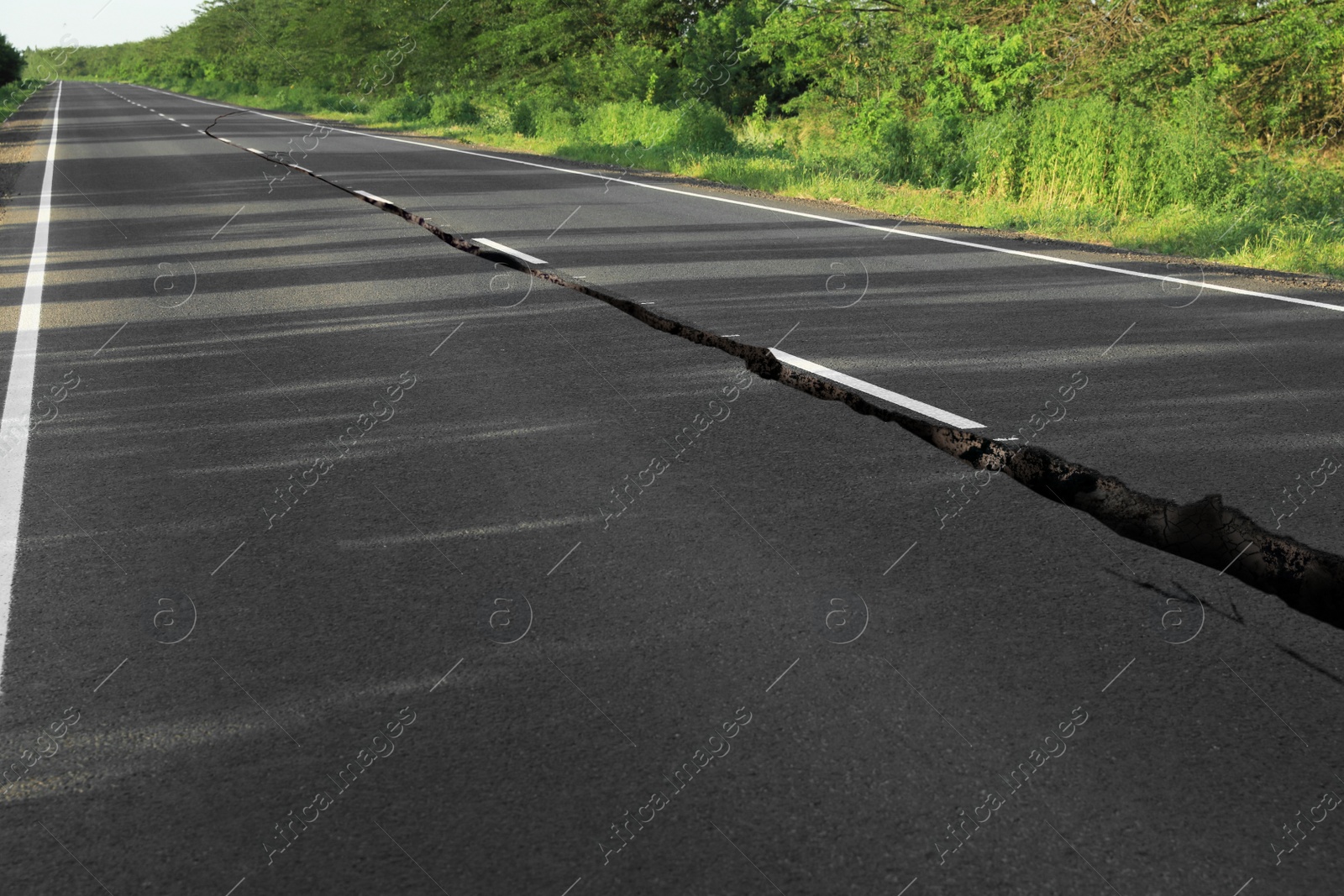 Image of Large crack on asphalt road after earthquake