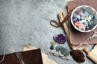 Photo of Flat lay composition with different gemstones on grey background