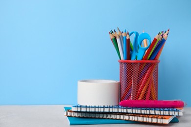 Photo of Different school stationery on table against light blue background, space for text. Back to school
