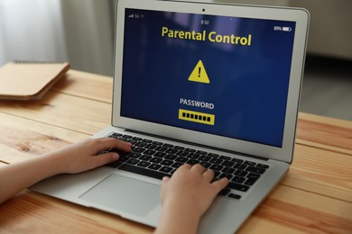 Child using laptop with installed parental control app at home, closeup. Cyber safety