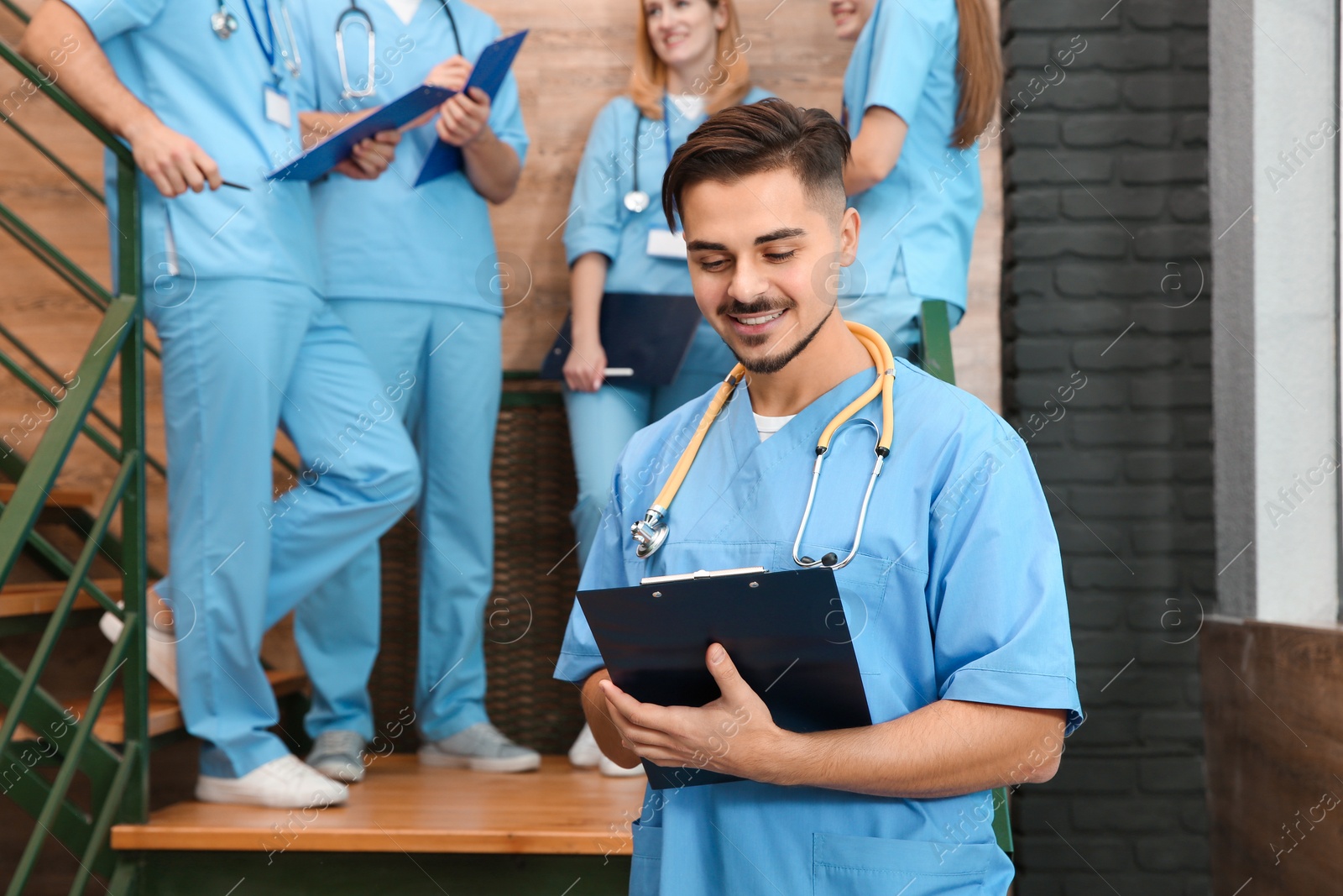 Photo of Medical student with groupmates in university hall