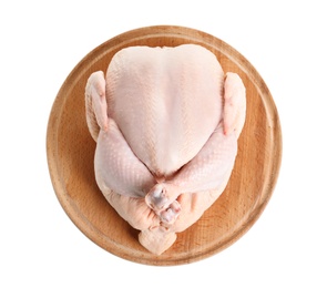 Wooden board with raw turkey on white background, top view