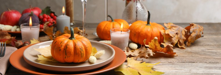 Image of Beautiful autumn place setting and decor on wooden table. Banner design