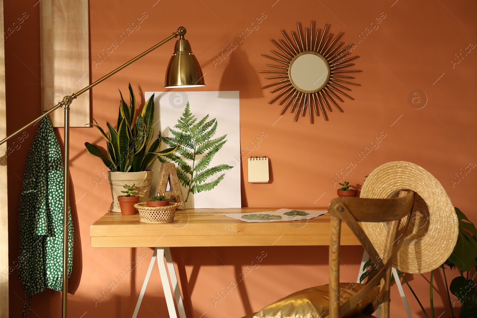 Photo of Beautiful room interior with wooden table near brown wall