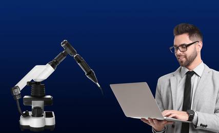 Image of Engineer controlling electronic laboratory robot manipulator with laptop on blue background. Machine learning