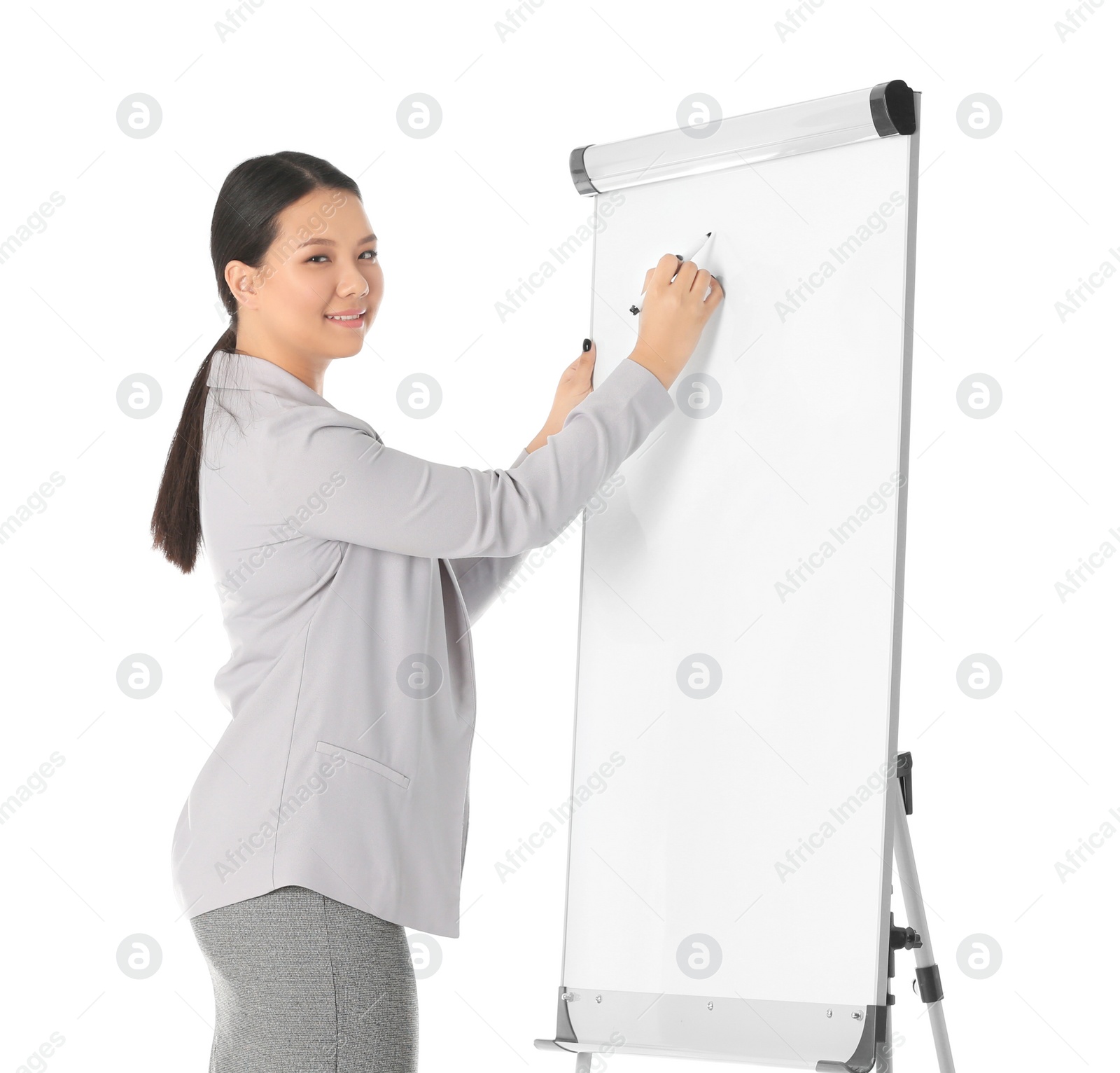 Photo of Business trainer giving presentation on flip chart board against white background