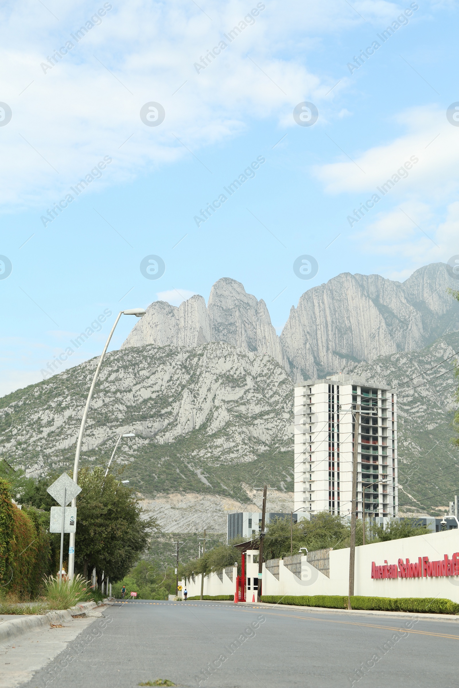 Photo of Mexico, San Pedro Garza Garcia - August 27, 2022: City street near beautiful mountains