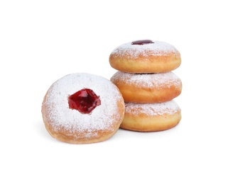 Photo of Hanukkah doughnuts with jelly and sugar powder on white background