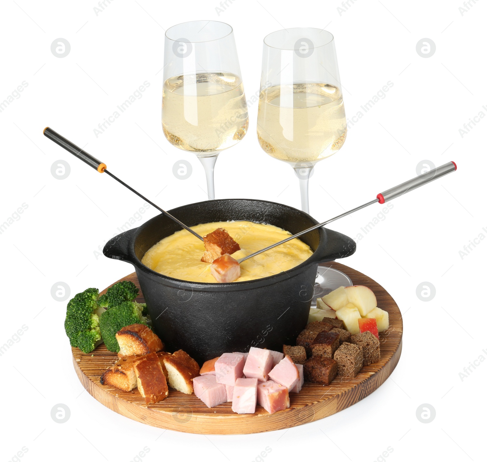 Photo of Fondue with tasty melted cheese, forks, glasses of wine and different products isolated on white